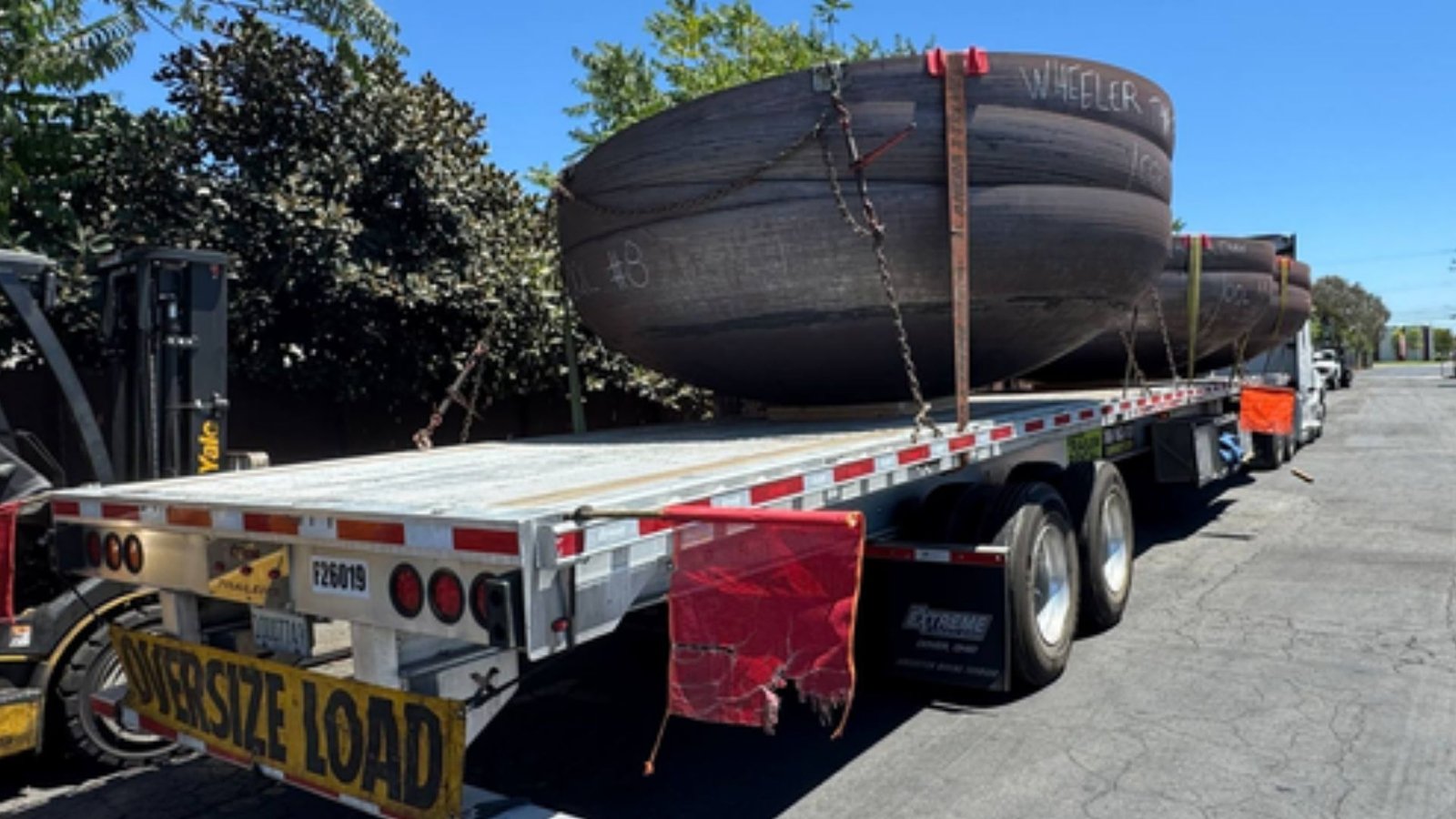 Oversized industrial equipment transported on a heavy haul trailer