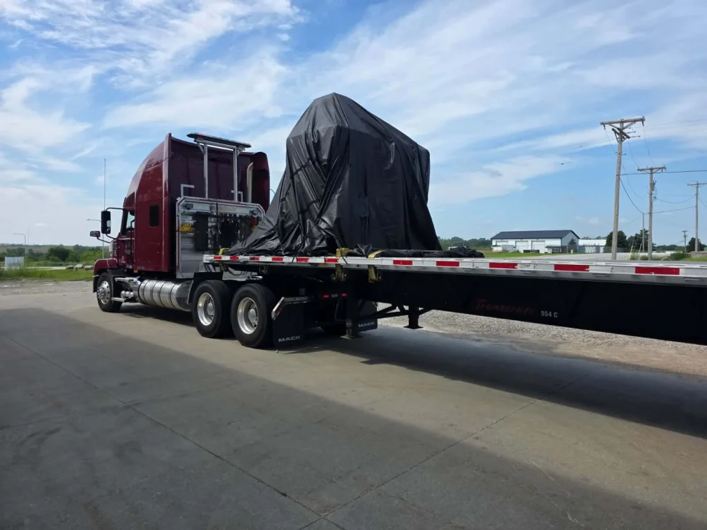 CNC machinery secured on a trailer for safe transportation
