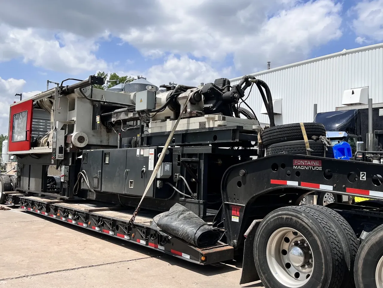 How to Ship an Injection Molding Machine on an RGN in Los Angeles How to ship an injection molding machine on a Fontaine Magnitude RGN trailer from Los Angeles