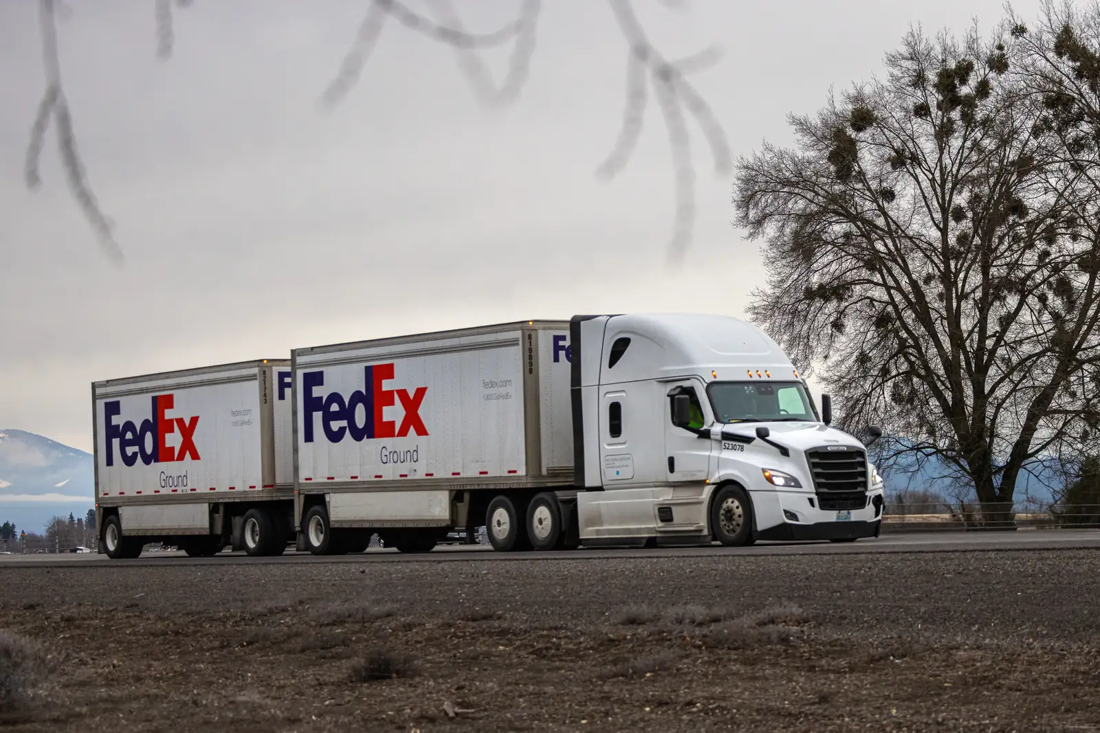 Semi pulling LTL pup trailers on a Southern California highway
