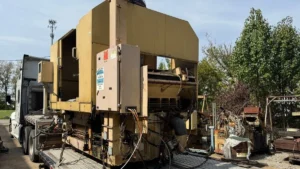Used Cincinnati centerless grinder tarped and secured on a step deck in Orange, California for Phoenix